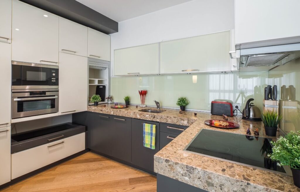 A well furnished brown kitchen modern style.